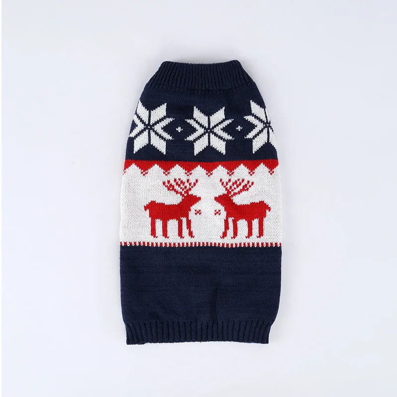 Navy blue knitted Christmas sweater for a dog on a hanger.