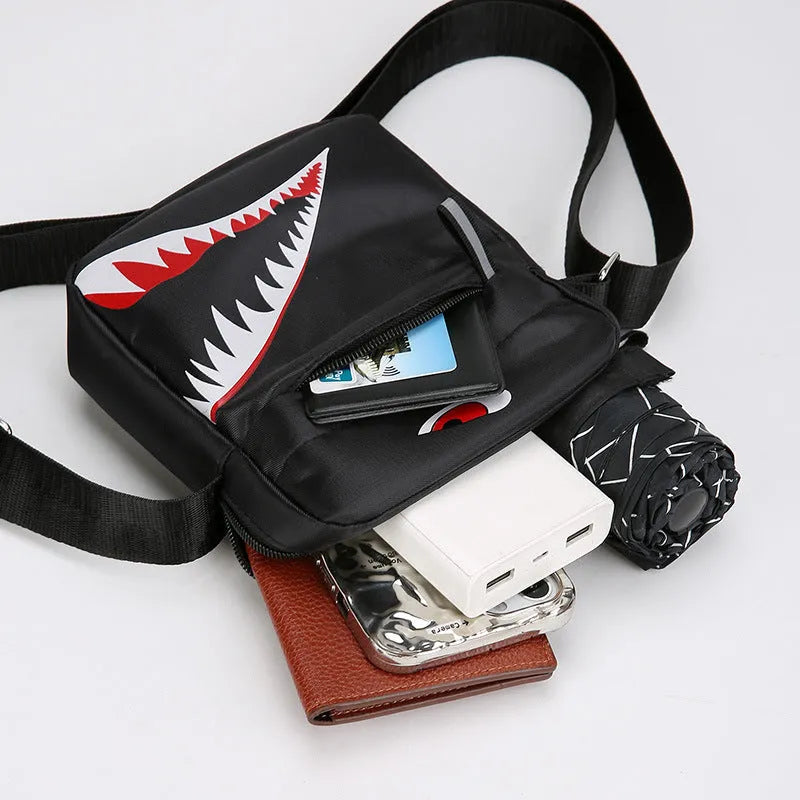 Men's black Oxford cloth crossbody bag with animal print pattern and adjustable shoulder strap