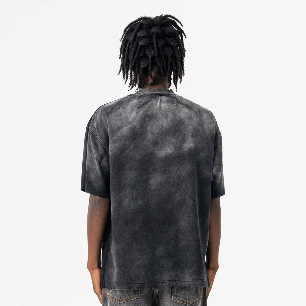 Black men's loose fit cotton t-shirt with printed white letter design and drop-shoulder sleeves.