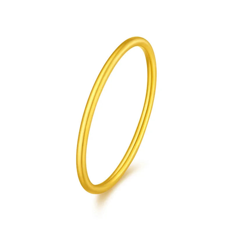 Simple bracelet brass gold plated ring in glossy finish on white background
