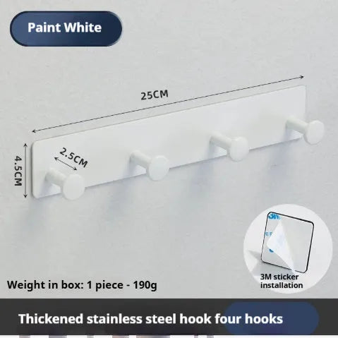 Iron screwless wall hook with multiple hooks mounted with adhesive tape on a glass shower door.