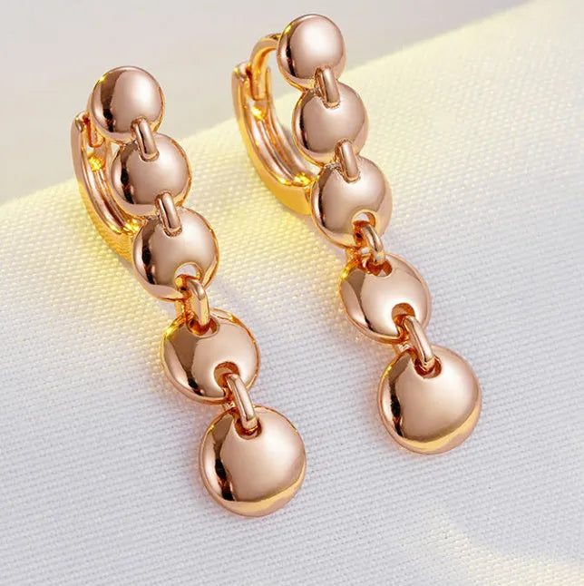 Retro long round circle earrings with woven copper construction and gold finish