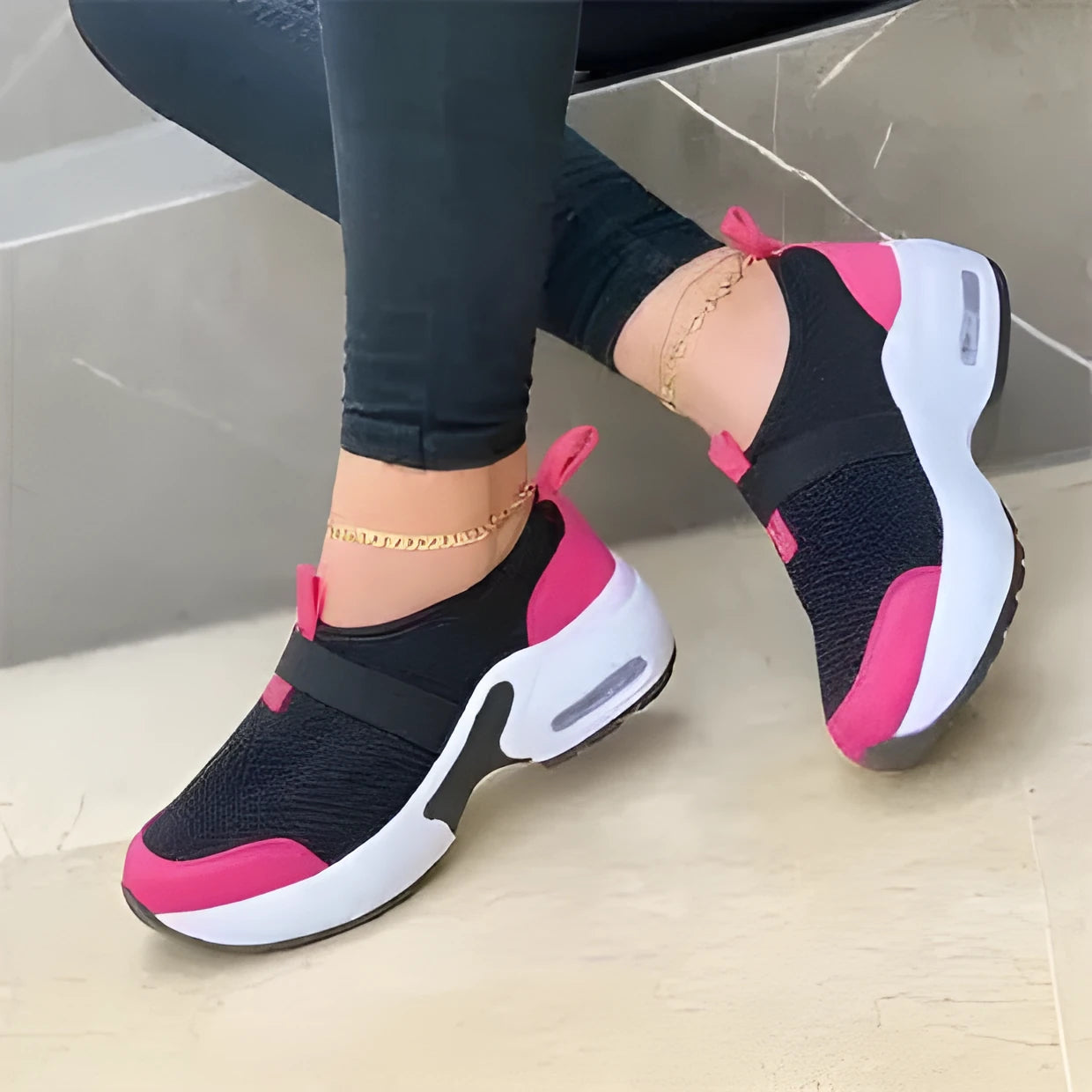 Women's white mesh flat sneakers with rubber sole and round toe on a light background