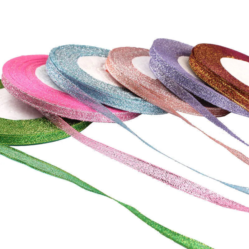 Roll of 0.6cm wide coloured polyester gift ribbon showing multiple colour options including metallic and fluorescent.