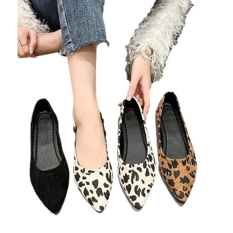 Women's flat pointed toe pumps with leopard print, cotton cloth upper, and low flat heel