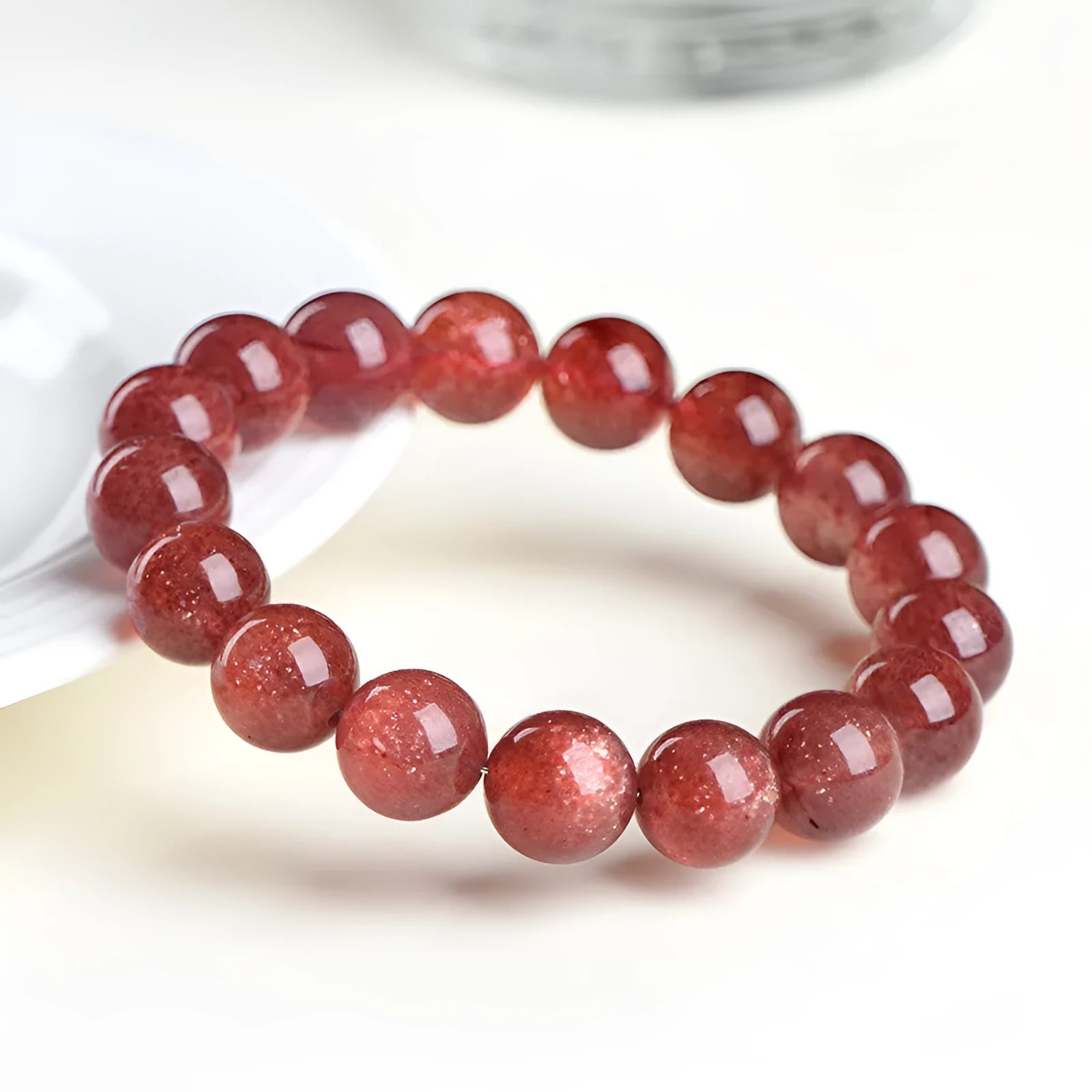 Natural strawberry quartz bracelet with geometric stones in starlight cherry red colour, shown in three size variations