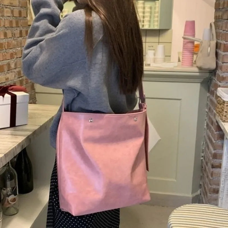 Corduroy one-shoulder commuter bag in pink colour with structured bottom