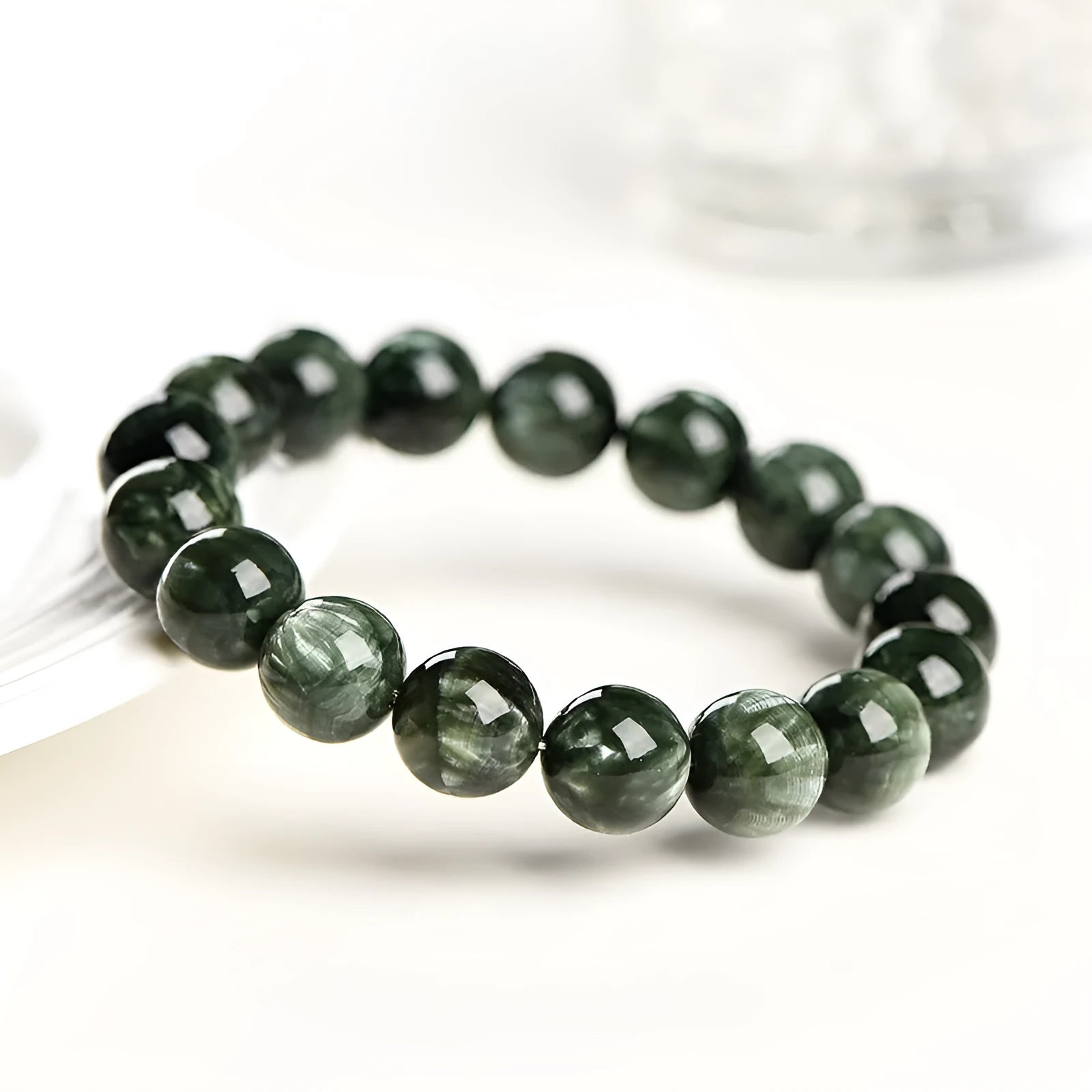 Green Dragon Crystal bracelet with round beads featuring Ruyi element design