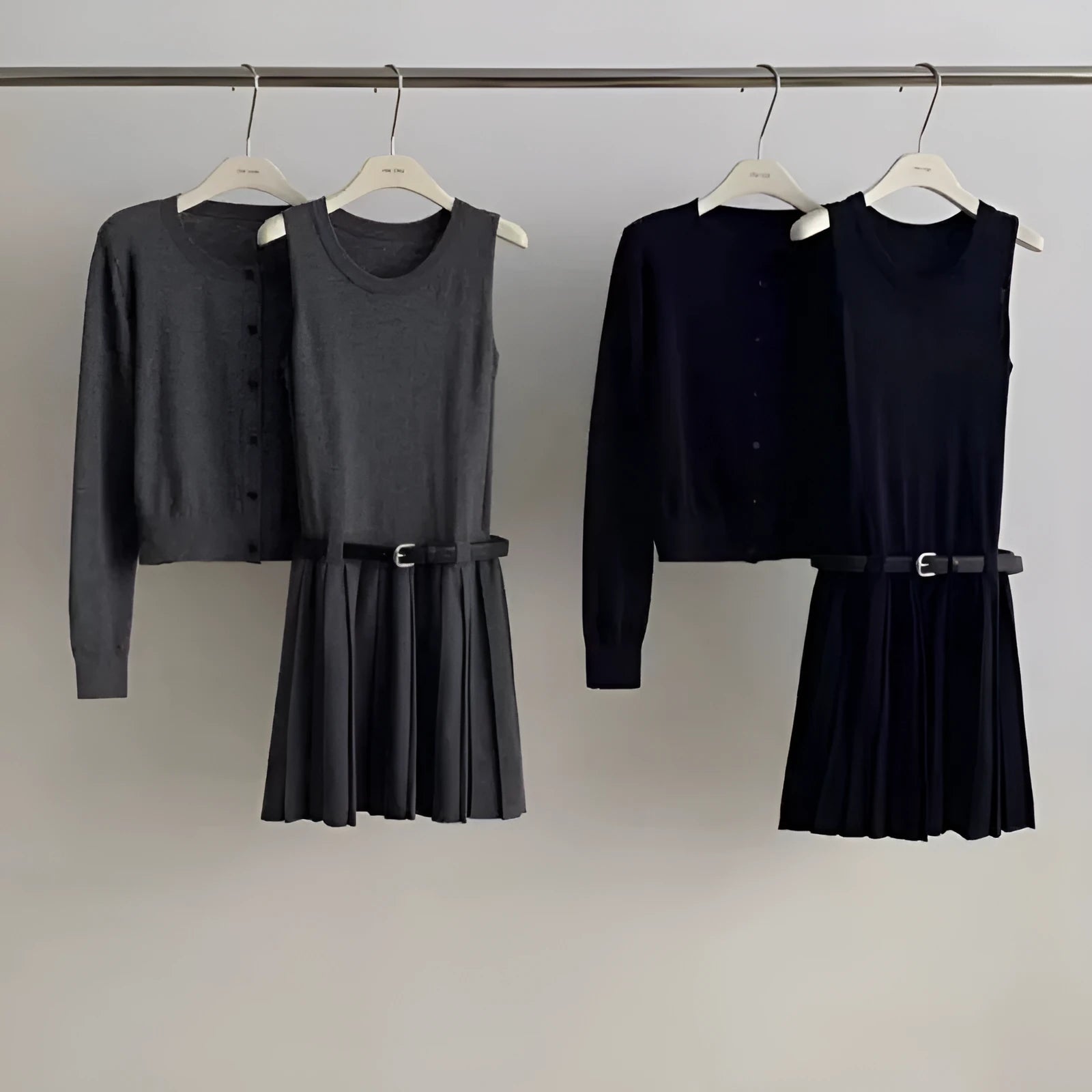 Women's grey knitted vest skirt and cardigan two-piece set with pleated design and belt