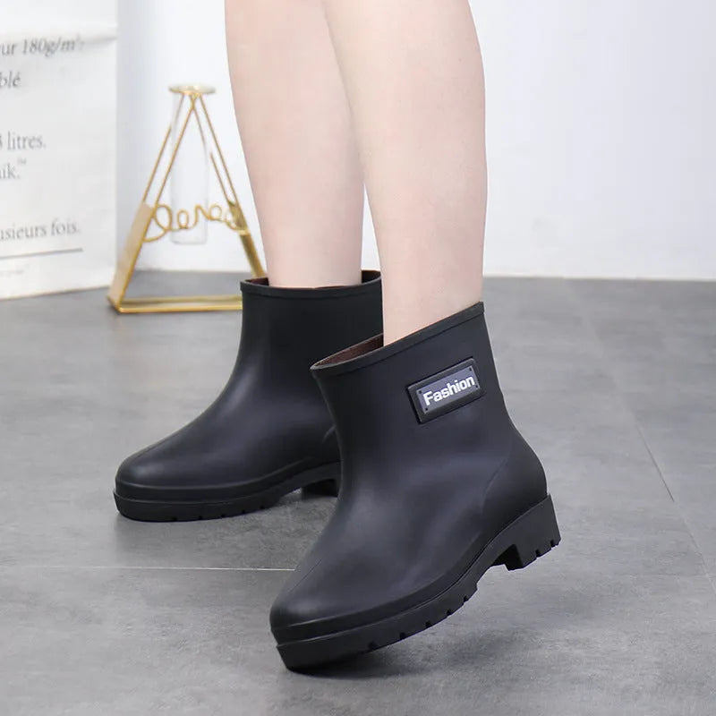 Women's PVC mid-calf rain boots in black with low heel, size 36-40