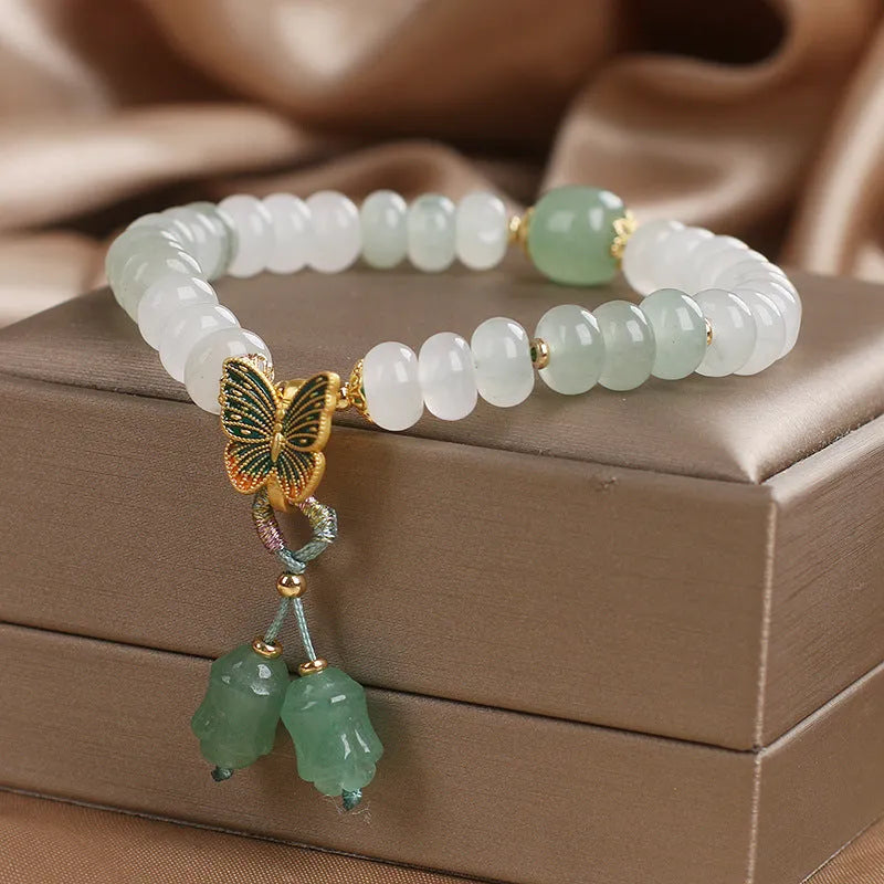 Tian Shan Cui green crystal abacus beads bracelet with butterfly tassel and pearl rhinestone sequin details, 17cm