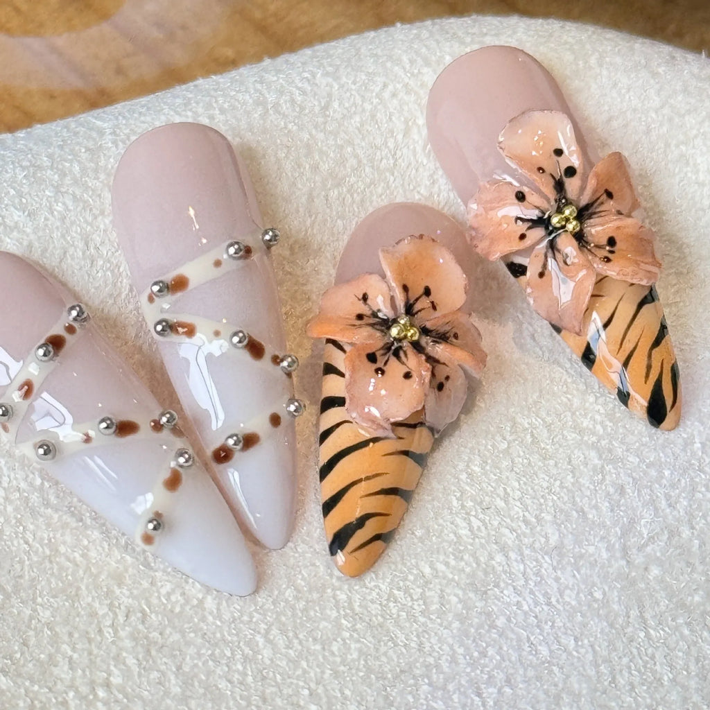 Handmade leopard, cross, and flower print nail stickers in four sizes on a backing card.