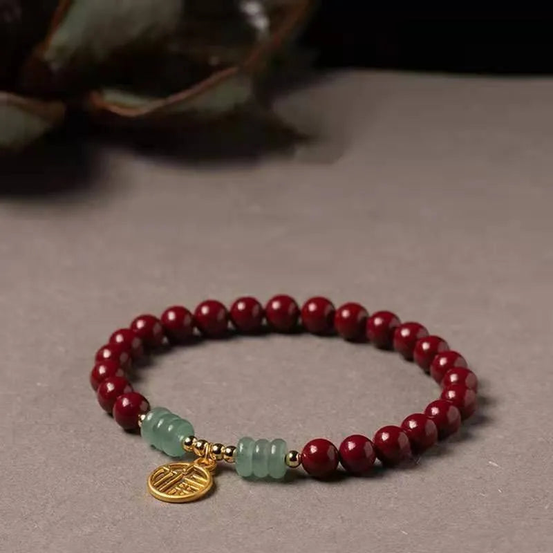 Gold cinnabar wave bracelet with copper bead on wrist, unisex national style