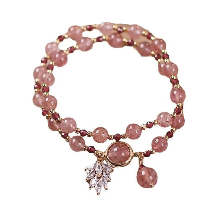 Women's double circle crystal bracelet with flower-shaped crystal detail in Strawberry Quartz colour