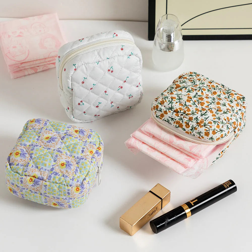 Floral print polyester key storage bag with sewing thread decoration in pink small flower colour.