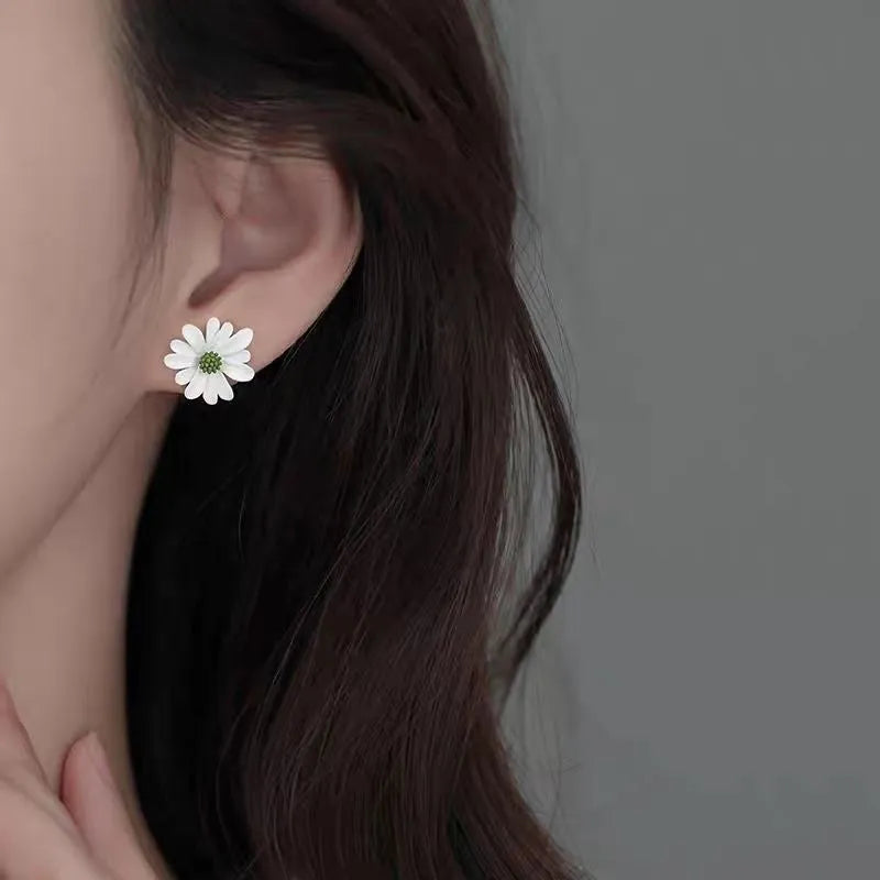 Cartoon-style flower alloy earrings in blue and orange, white and green, and yellow and white two-tone colour options