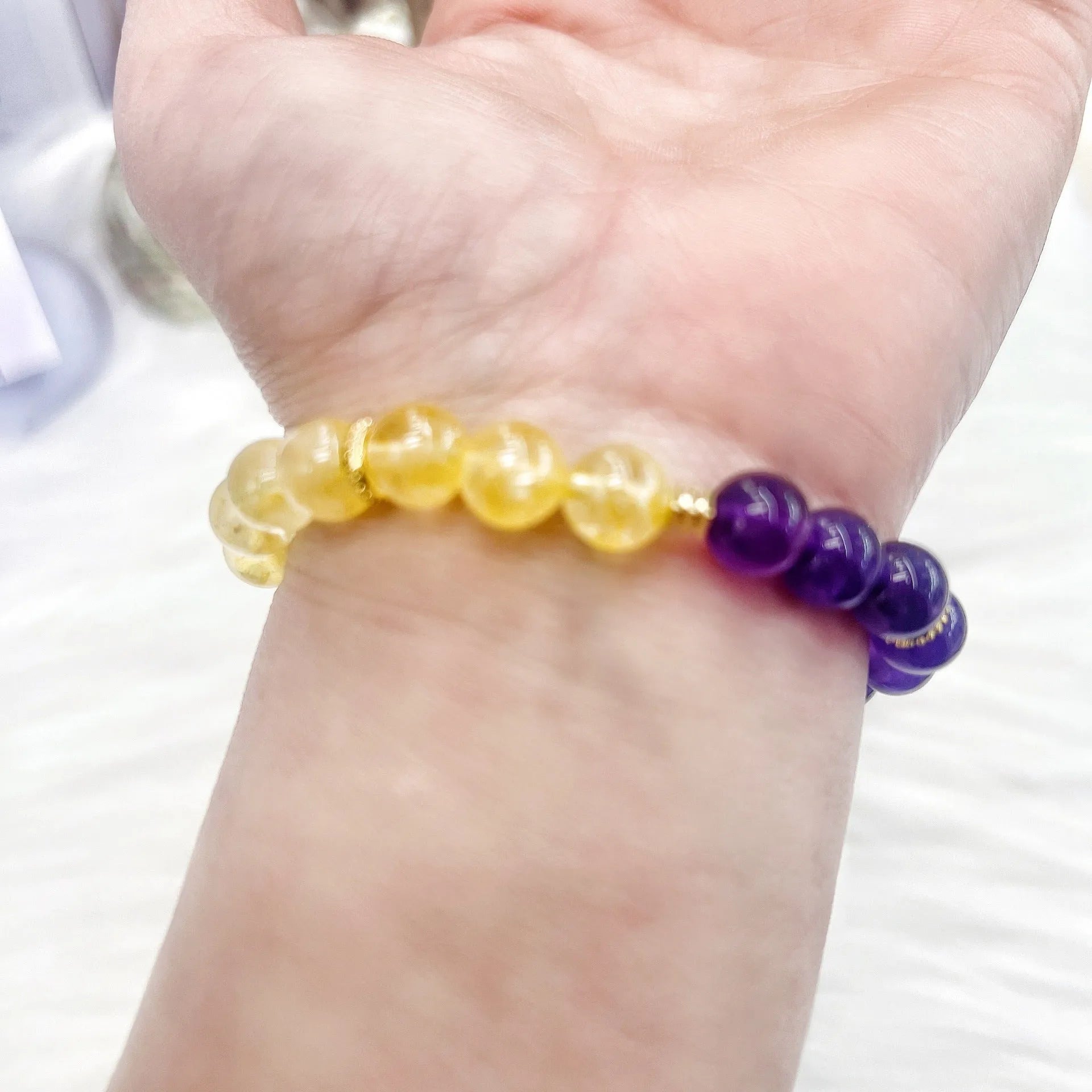 Handmade yellow and purple crystal amethyst bracelet for women showing artisan craftsmanship