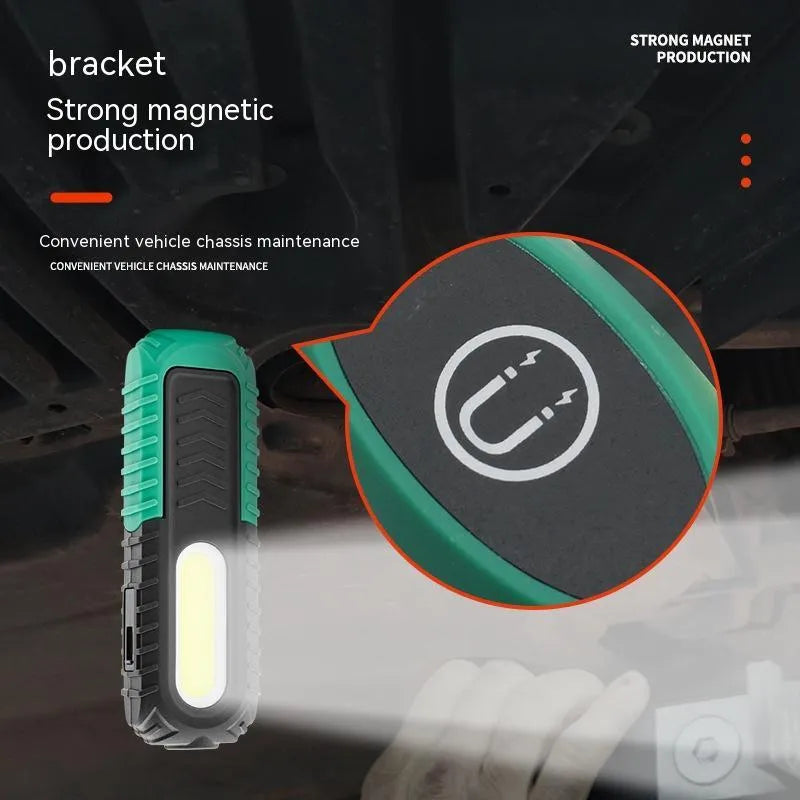 Black and green USB-charging auto repair work light with compact handheld design
