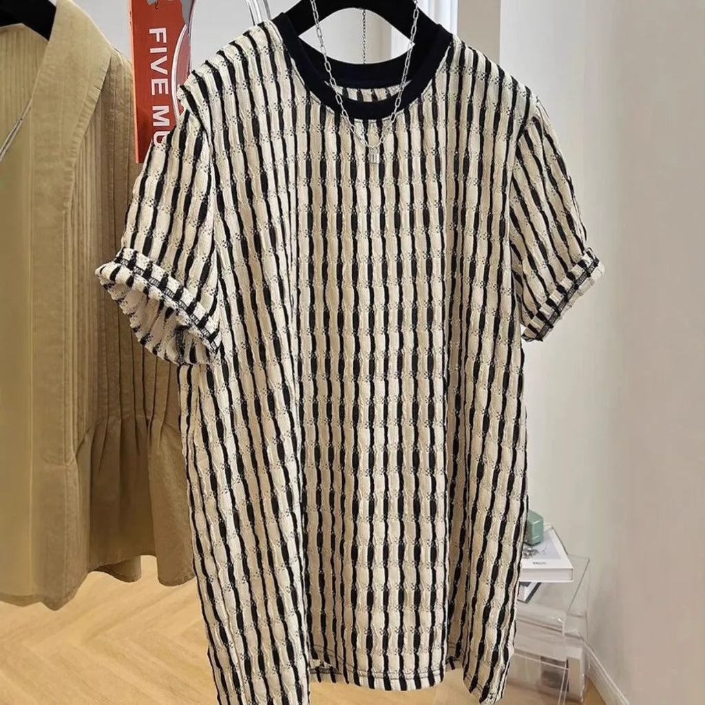 Men's black striped casual shirt with loose fit and short sleeves on hanger