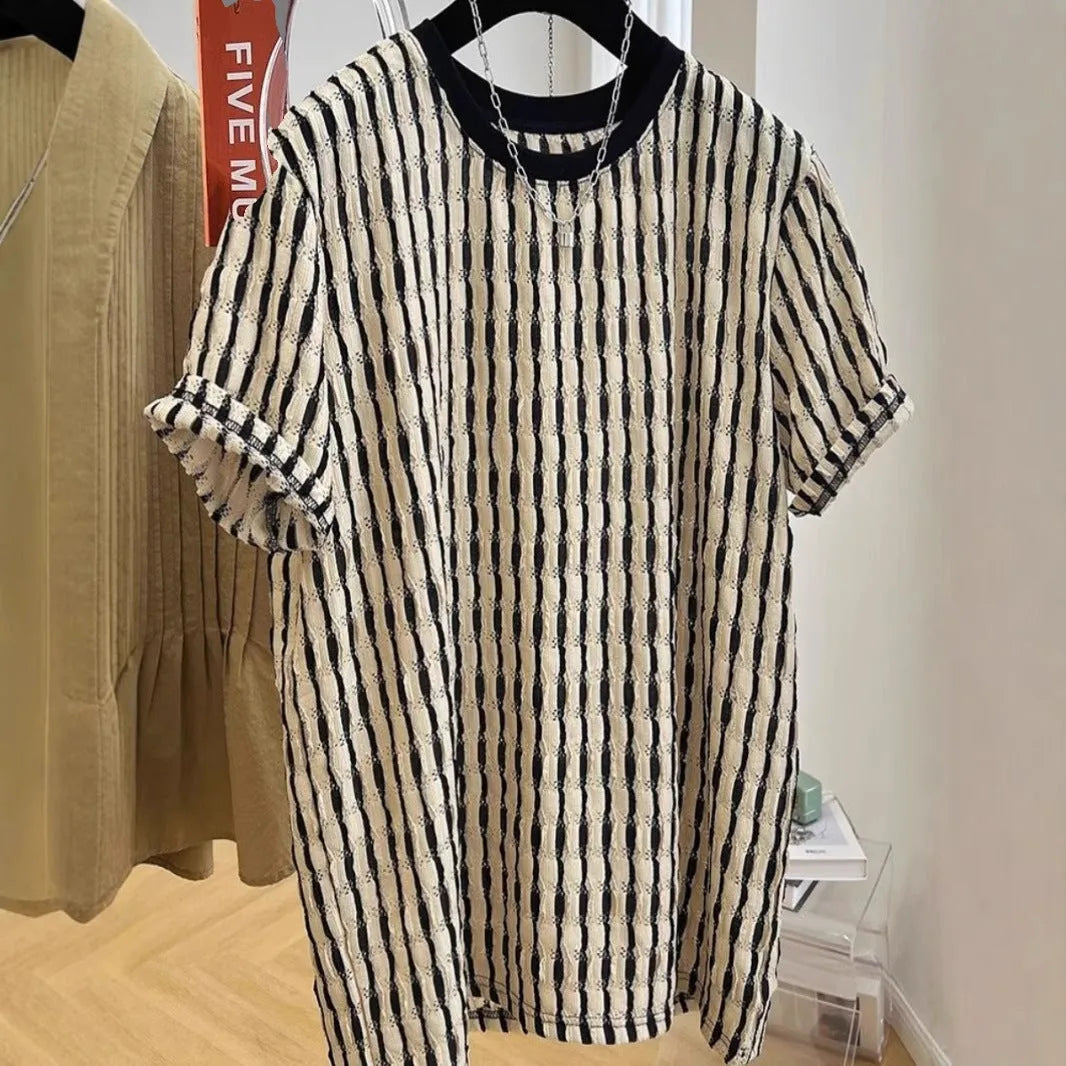 Men's black striped casual shirt with loose fit and short sleeves on hanger