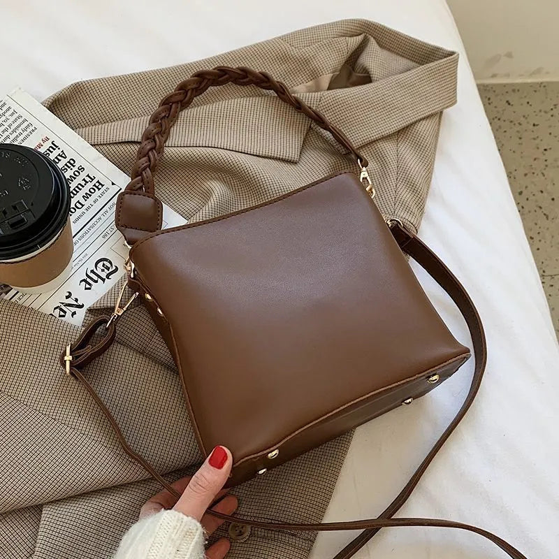 Retro brown PU leather crossbody bucket bag with a woven texture design.