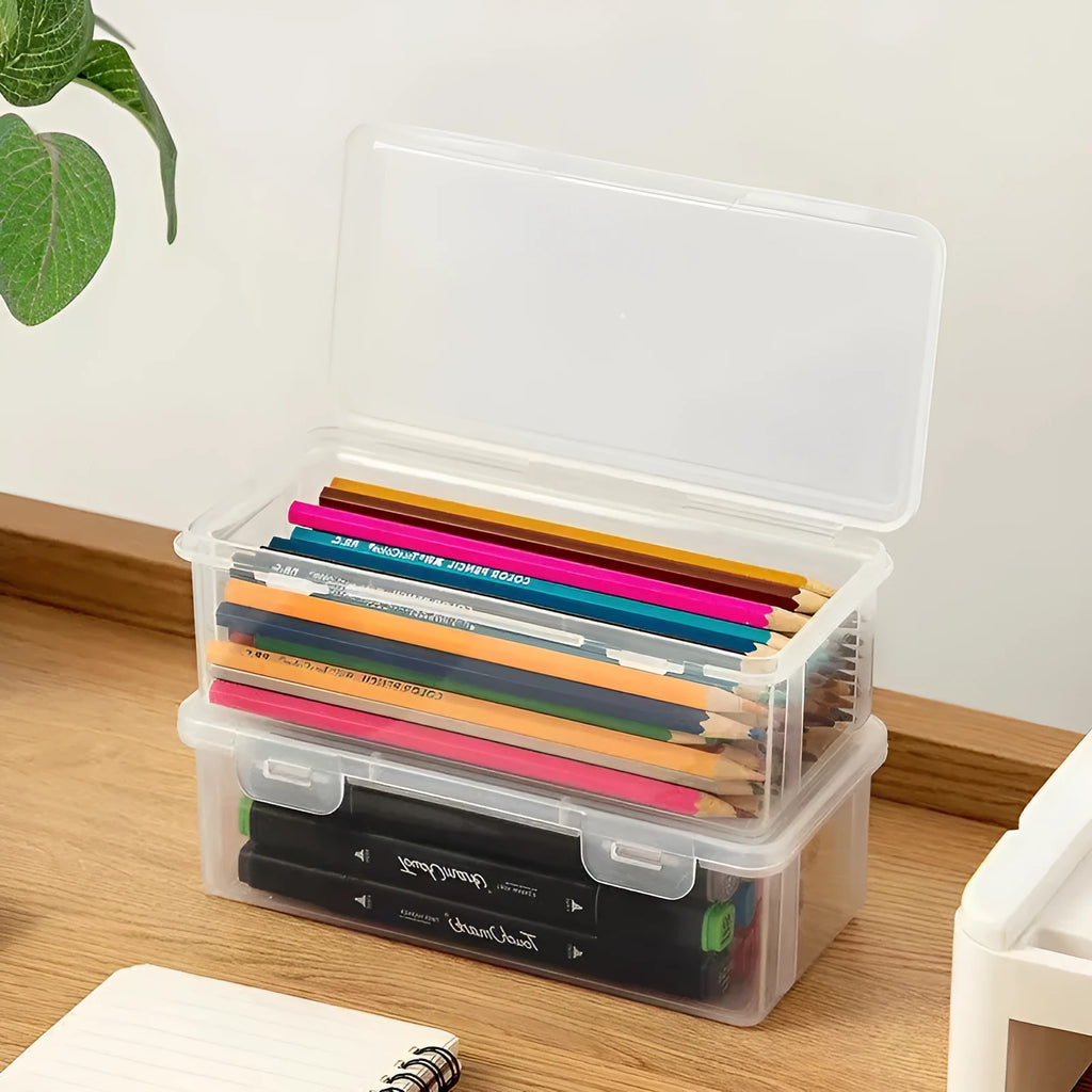 Transparent plastic stationery storage box showing pencils and art supplies inside