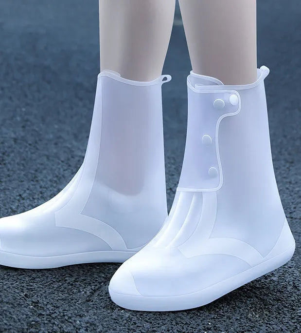White high-top PVC reusable shoe covers for women, shown with size chart.