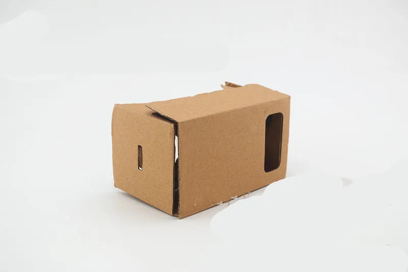 Pink and white cardboard VR glasses viewer for smartphones with 3D lenses.