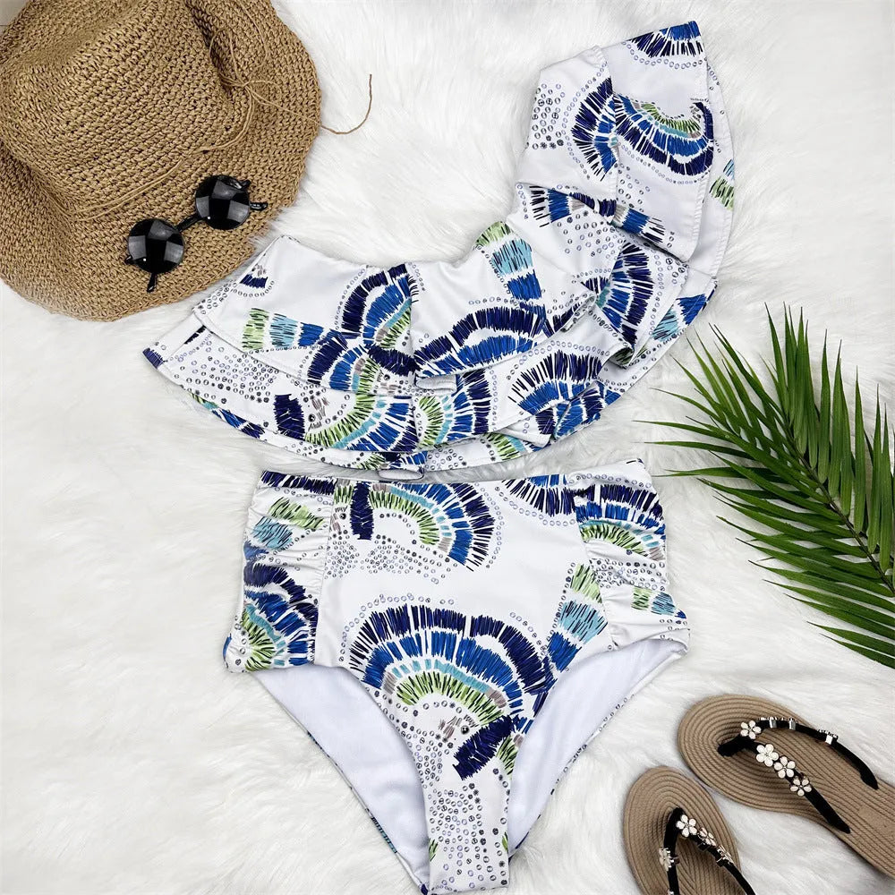 White women's one-shoulder swimsuit with lotus leaf design and high leg split