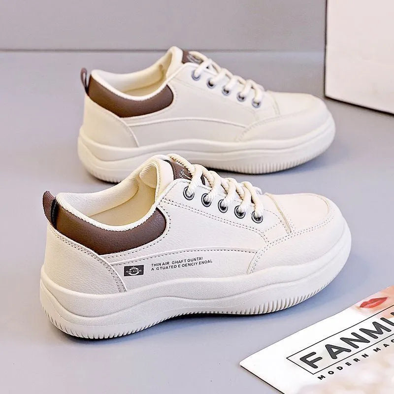 Women's white Korean style pumps with cross straps and lace-up design showing round toe and mid heel