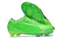 Men's football boots with knitted upper, FG studs, and built-in air cushion on green grass