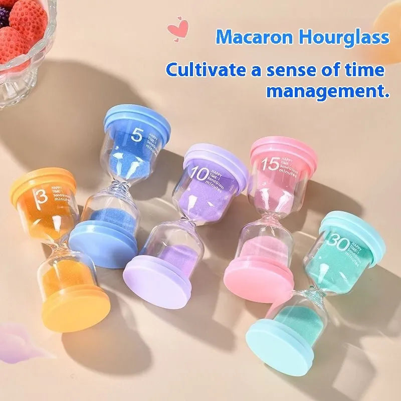Glass sand clock timer with blue sand showing 30 minute duration on a white surface