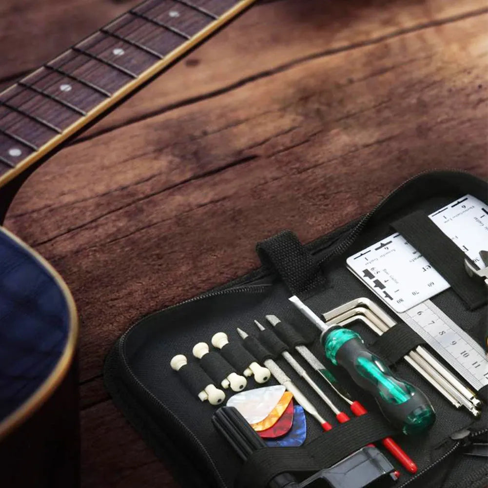 Black plastic and metal guitar repair tool kit for guitars, basses, mandolins, and banjos