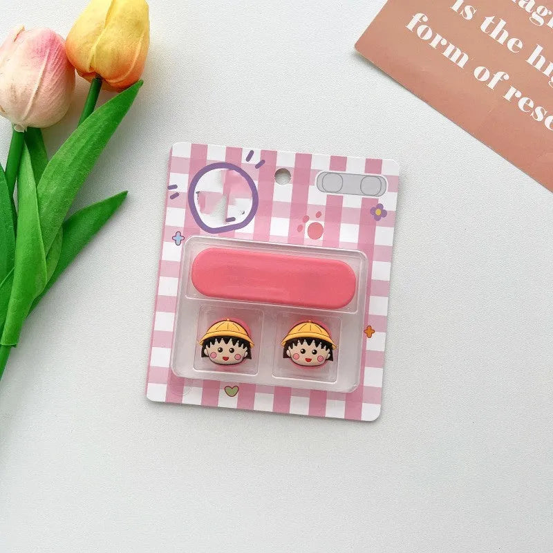 Colourful cartoon character plastic clip holding a magnetic charging cable on a desktop