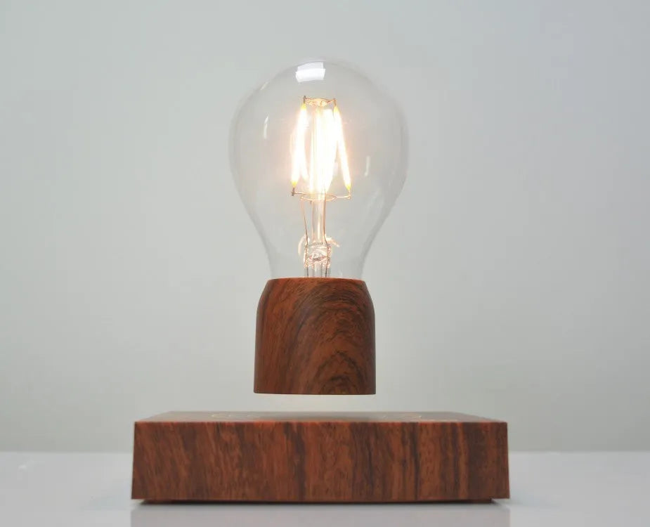 Magnetic levitation floating bulb lamp with ABS glass construction on imitation wood base