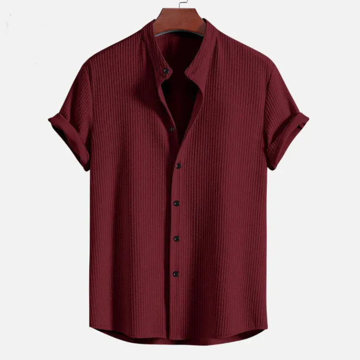 Men's loose short sleeve shirt in polyester available in multiple colours including wine red and dark green.