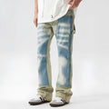 Retro yellow and blue patchwork jeans with splash-ink damaged design detail