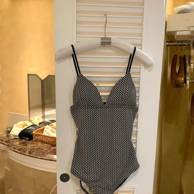 Blue and black one-piece swimsuit for women with belly coverage design