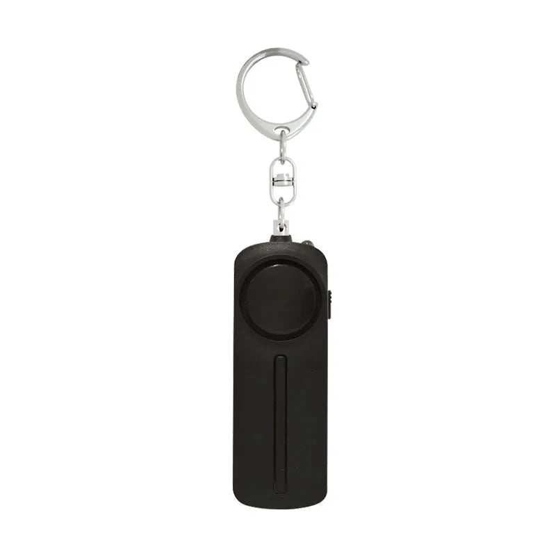 Pink personal safety alarm with keychain measuring 86 x 30 x 20 mm
