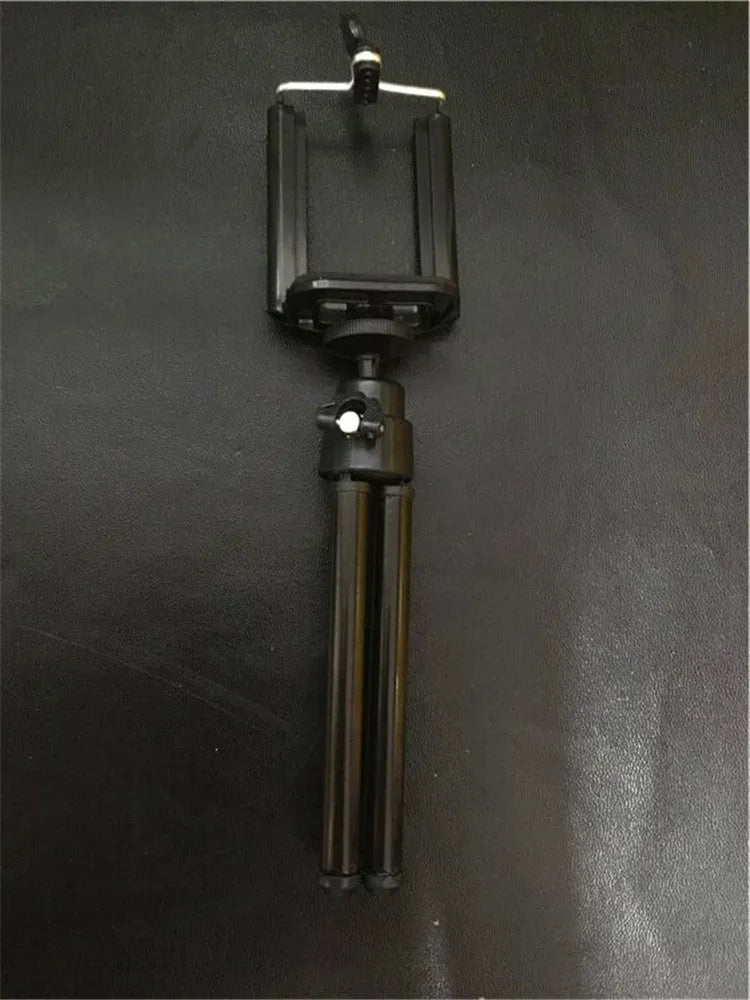 Black desktop phone holder with two-section adjustable metal bracket and clamp base