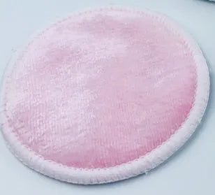 Set of pink and blue velvet makeup remover pads next to an organic cotton drawstring mesh bag.