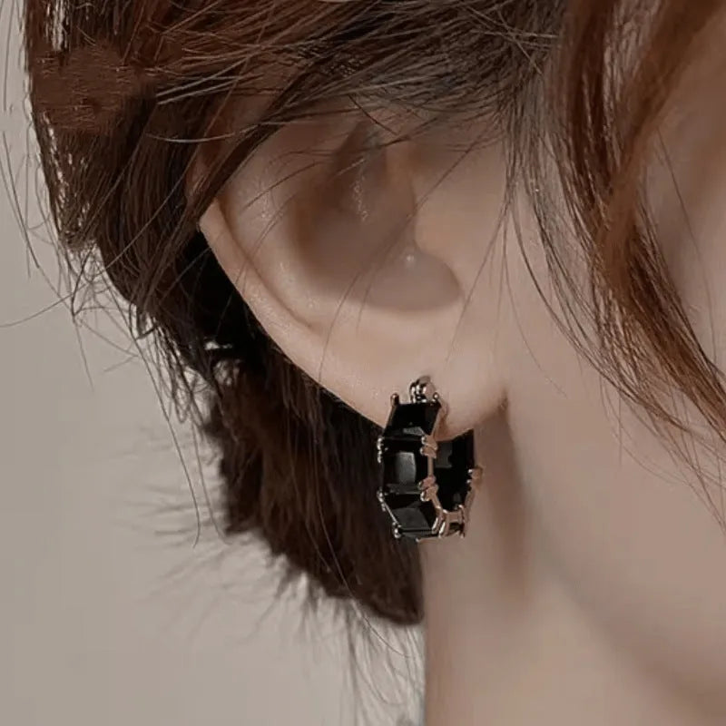 Geometric U-shape women's earrings with round black zircon crystals in gold electroplated settings