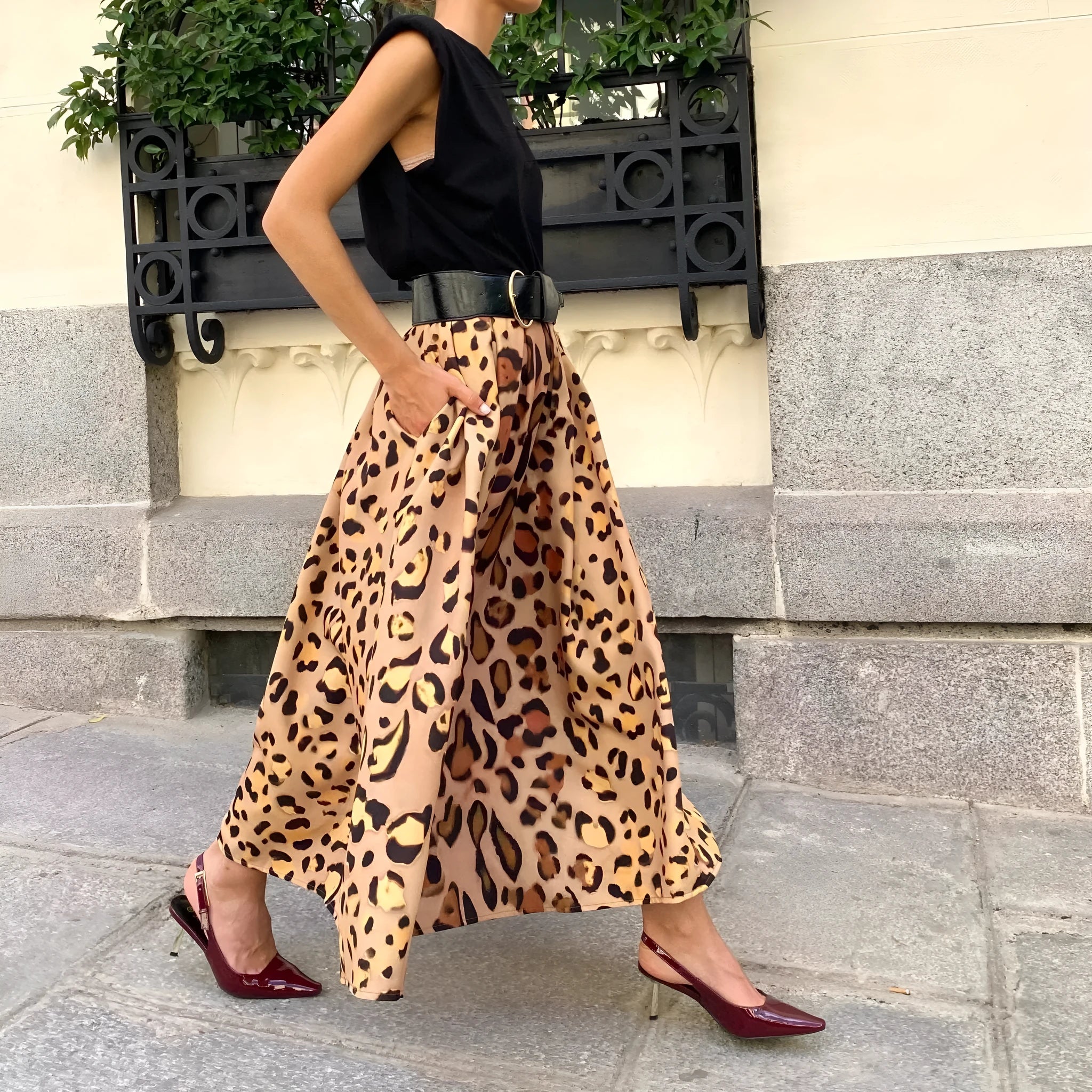 Brown leopard print women's A-line long skirt with elastic waistband laid flat.