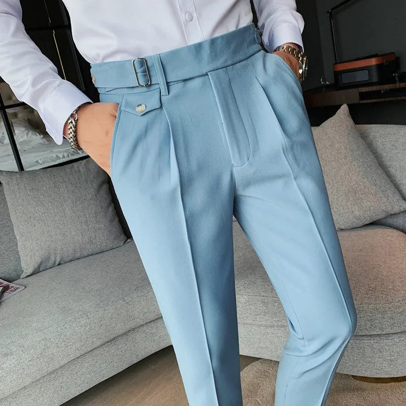 Men's straight-leg casual trousers in solid colours including black and grey, laid flat.