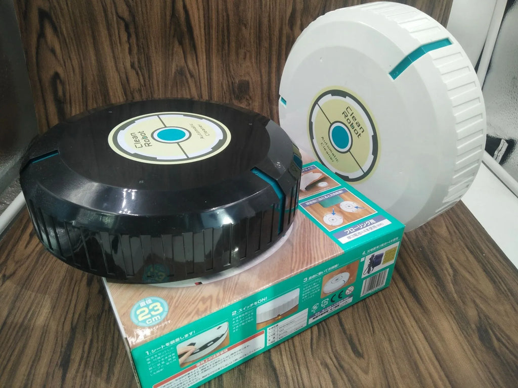 AC Sweeping Robot automatic vacuum cleaner in black or white on a wooden floor.