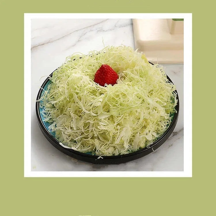 Beige multifunctional vegetable slicer chopper with stainless steel blades on a kitchen counter