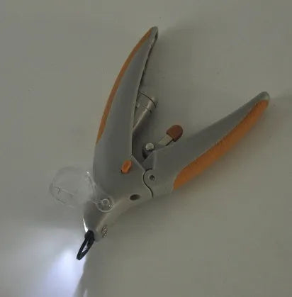 Pet nail clipper with LED light for dogs and cats, ABS plastic body, size 14.5 x 9 x 2.8 cm