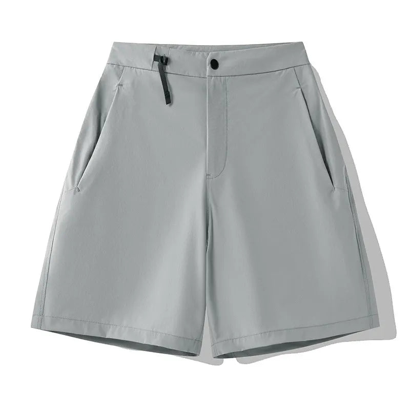 Men's solid colour quick-dry sports shorts with elastic waistband shown in Army Green