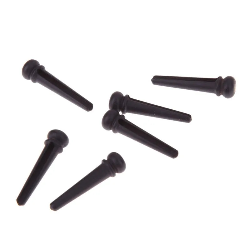 Six matt black ebony bridge pins for folk acoustic guitars with 5.3mm bayonet diameter