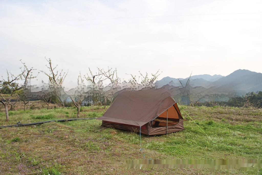 Brown A-frame hiking tent supported by hiking poles showing spacious interior for 2-3 campers